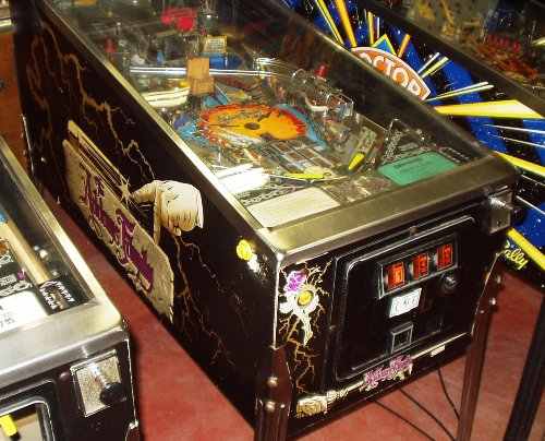 Addams Family pinball machine with gold cabinet